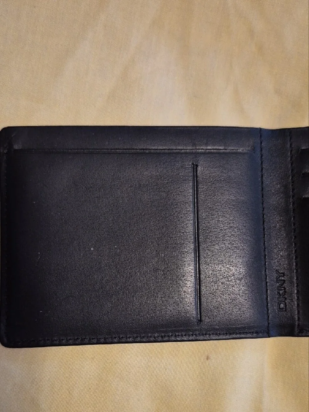 DKNY Black Leather Men's Wallet with Subtle Logo